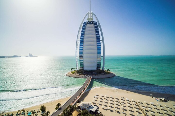 Discover Dubai's iconic skyline with the stunning Burj Al Arab. Enjoy the blend of modern architecture and serene beach views perfect for capturing unforgettable memories.